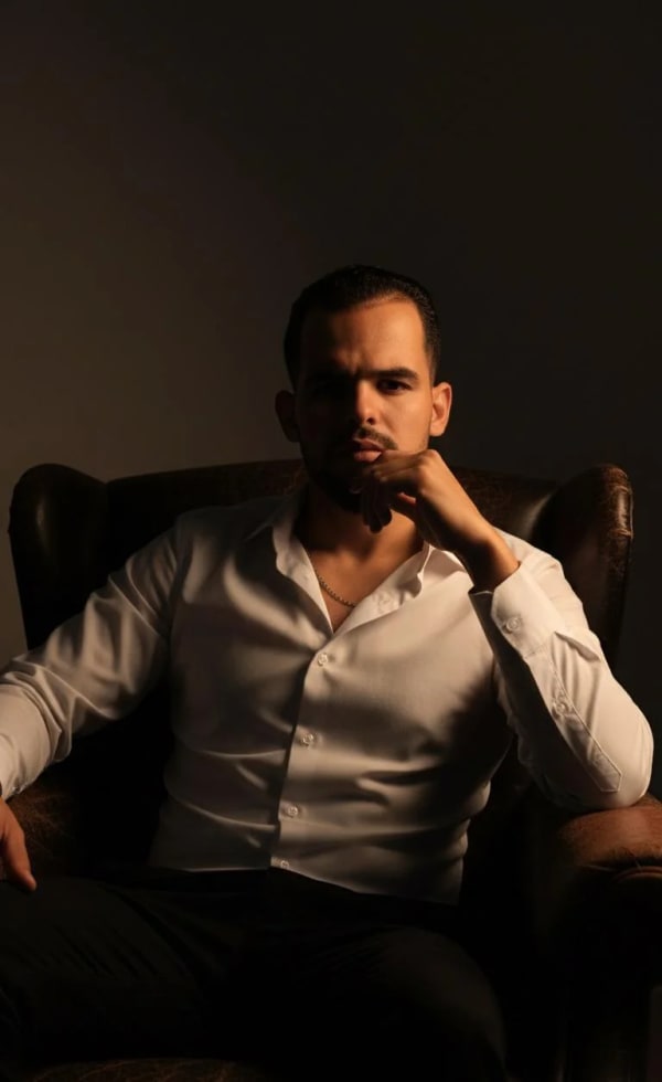 Elegant man in leather armchair — AI image prompt example