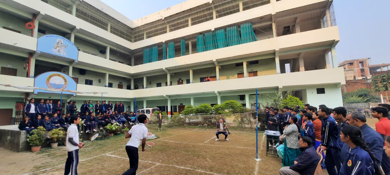 Students and teachers of Shandilya Public School with medals and trophies at a prize ceremony