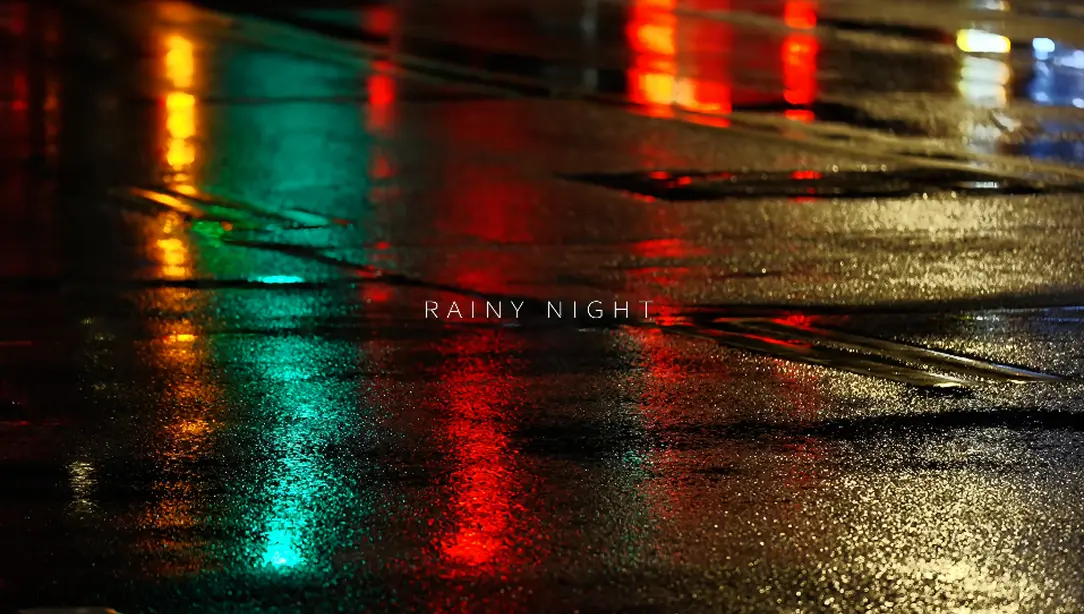 Colourful lights on wet pavement