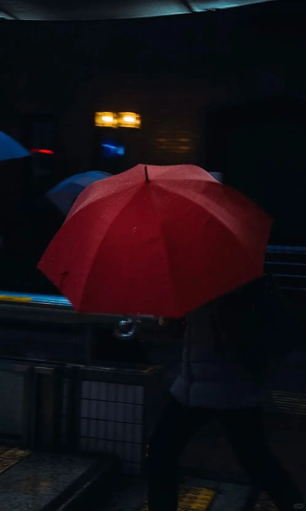 A red umbrella at night