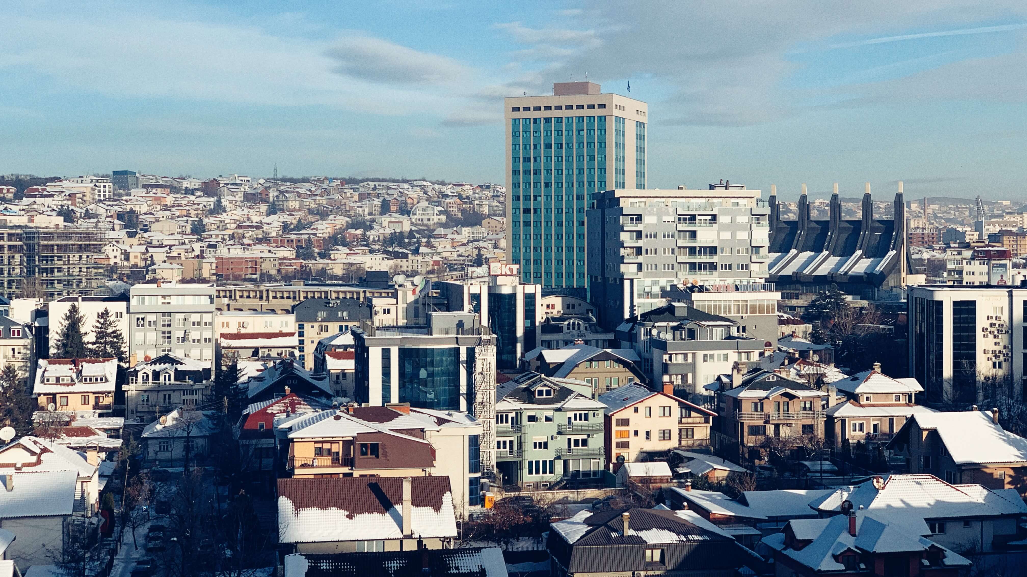 Sunny Morning in Pristina. The tall blue building in distance is the Kosovo government building.