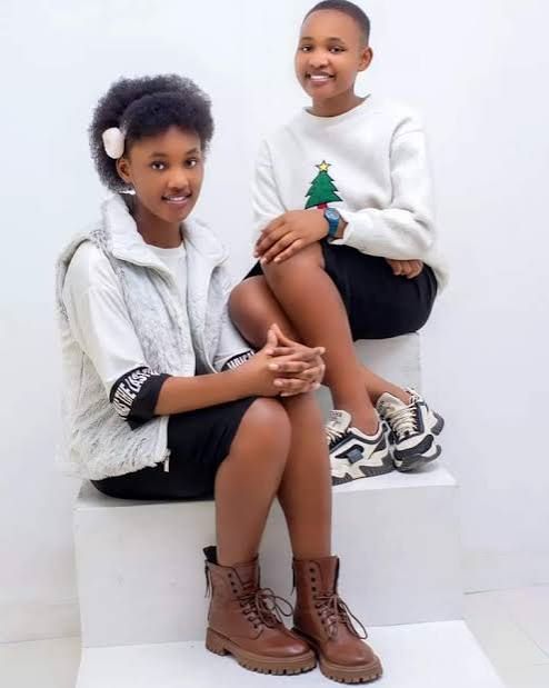 Germaine wo mu itsinda rya Alicia and Germaine yishimiye intsinzi mu bizamini bya Leta