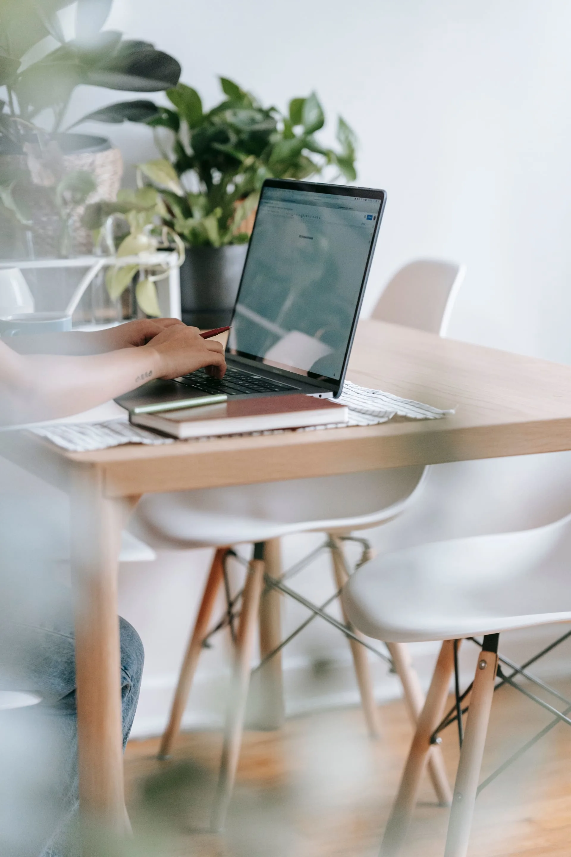 A professional working at a desk with a laptop