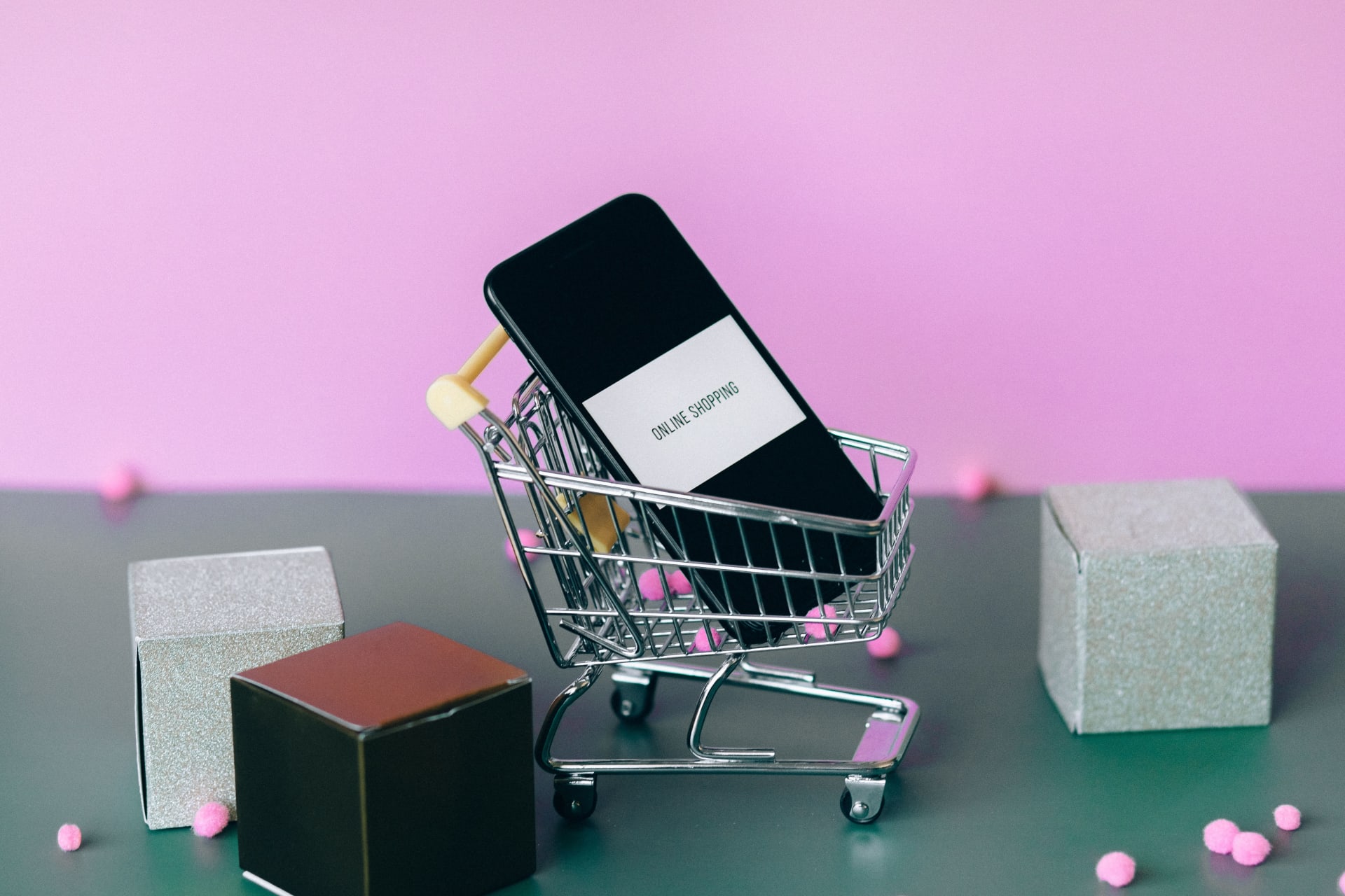 e-commerce image of a mini shopping cart with a phone in it