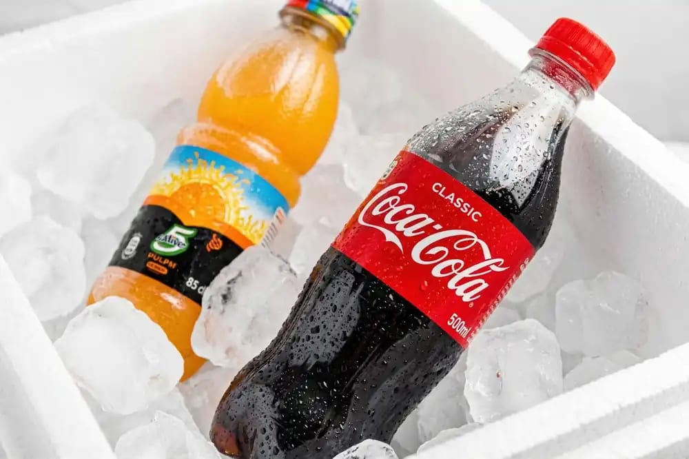 Vida Fresca wholesale beverage crates — Coca-Cola and 5Alive Pulpy stacked and ready for delivery